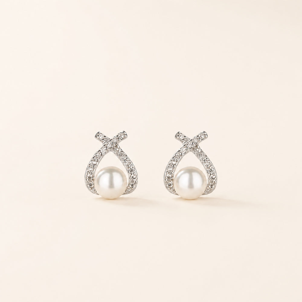 Pearl Knot Studs on warm ivory background