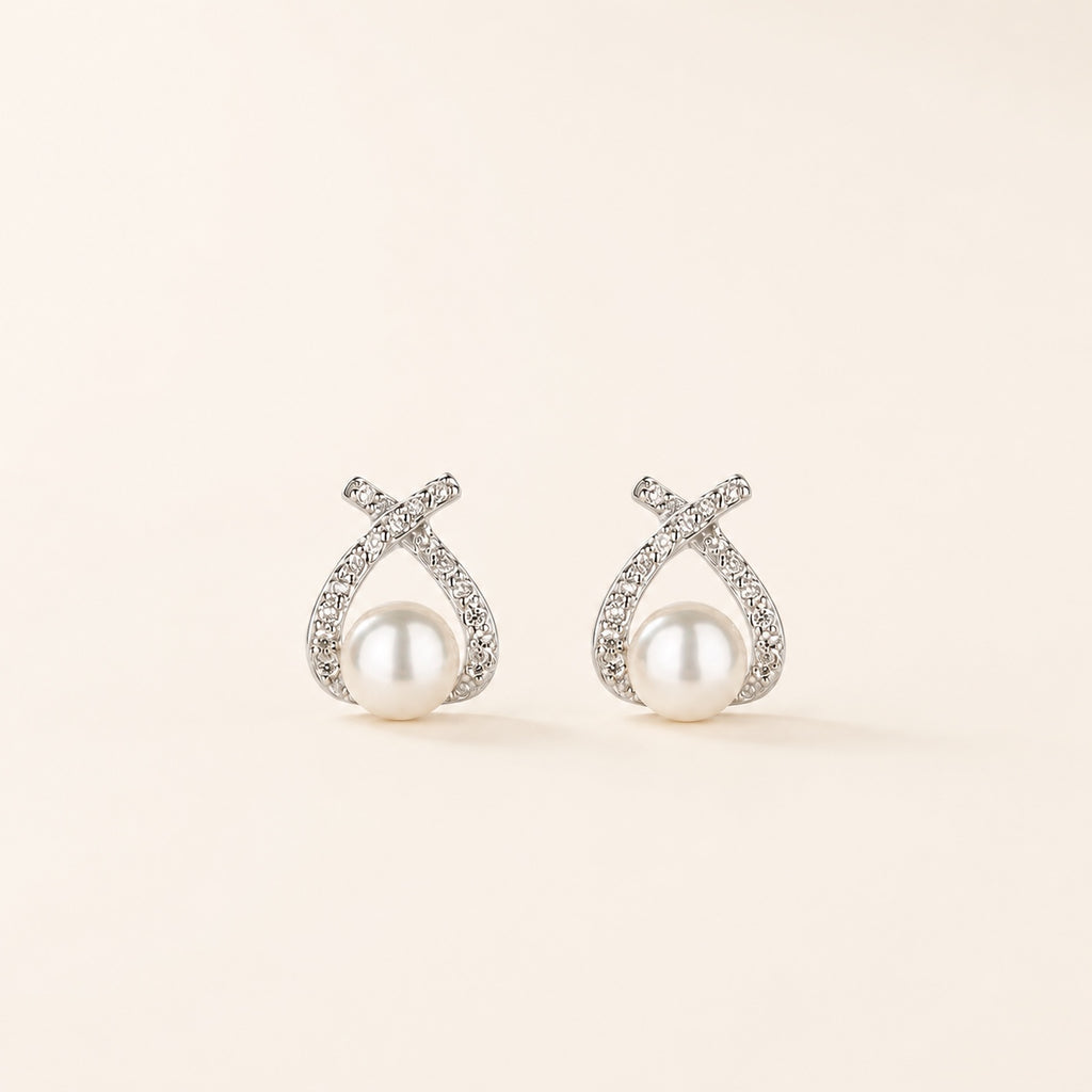 Pearl Knot Studs on warm ivory background