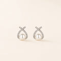 Pearl Knot Studs on warm ivory background