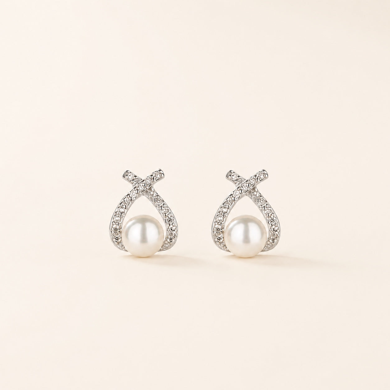 Pearl Knot Studs on warm ivory background