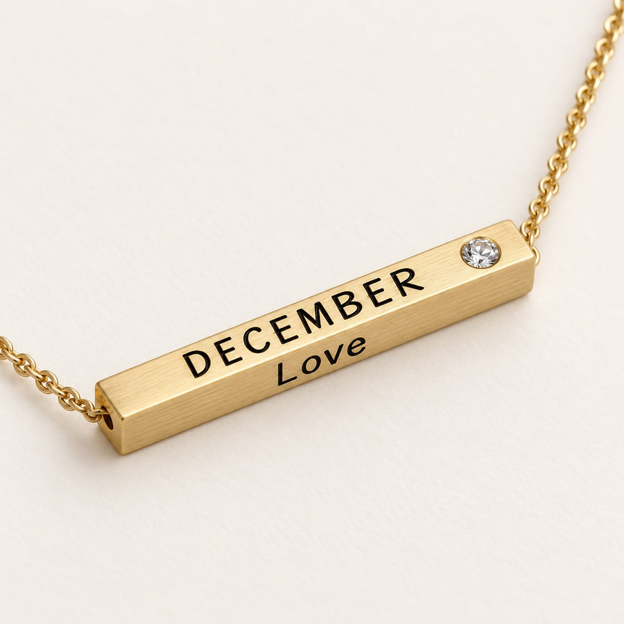 December Month of Love gold bar necklace close-up detail