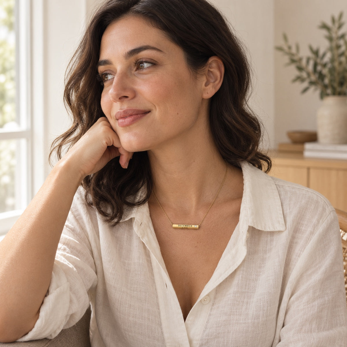 December Month of Love necklace worn with a white linen shirt