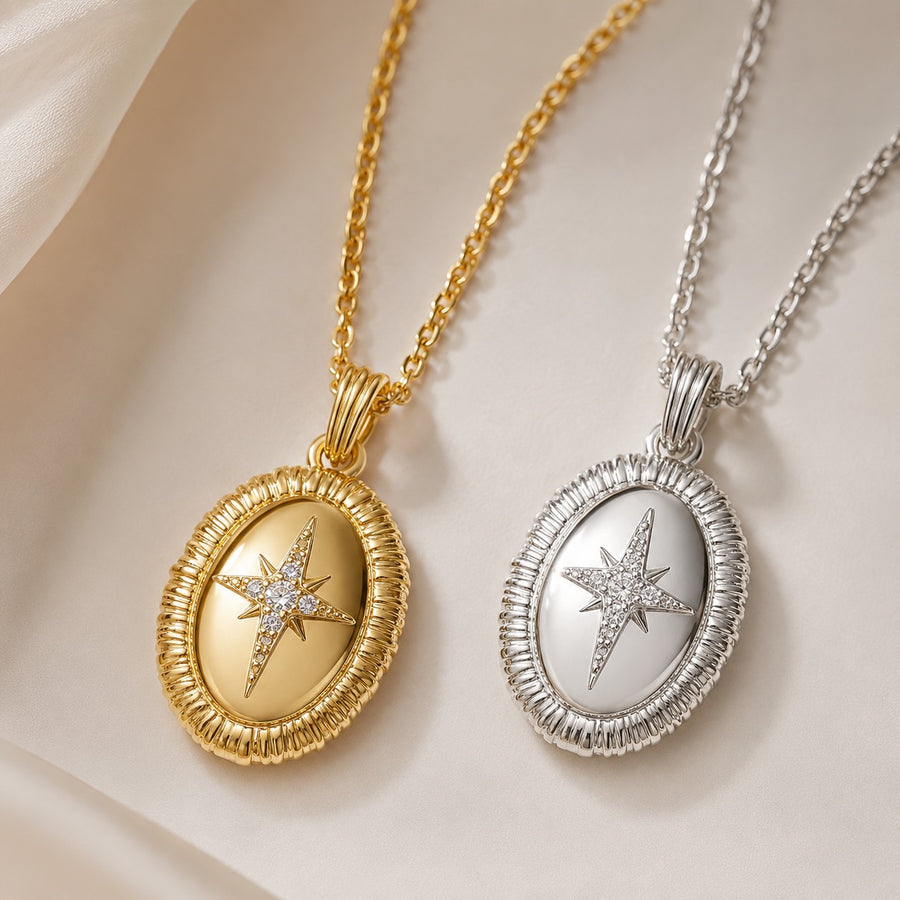 Close up of Stella Oval Pendant Necklace in gold and silver finishes