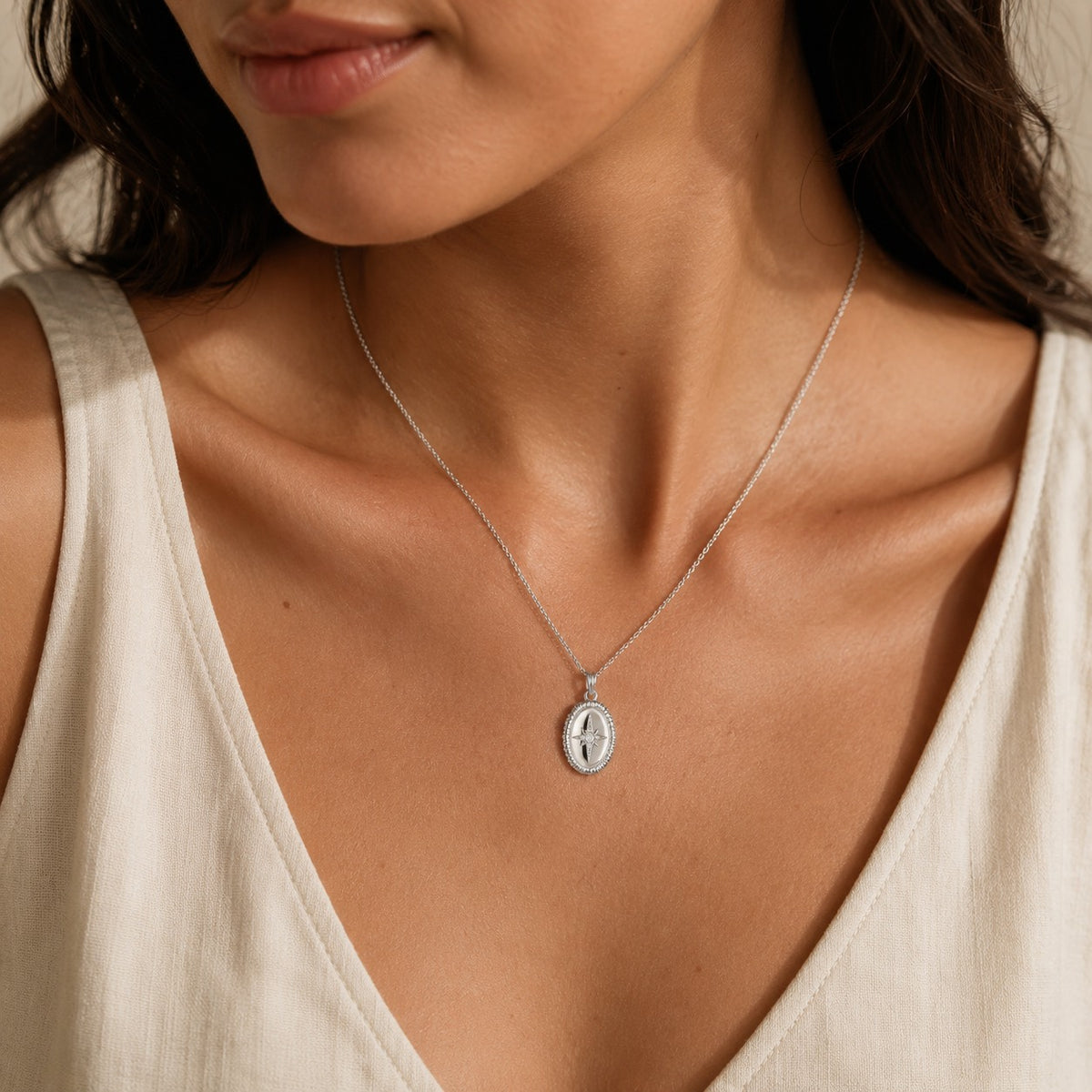 Stella Oval Pendant Necklace in silver styled on model
