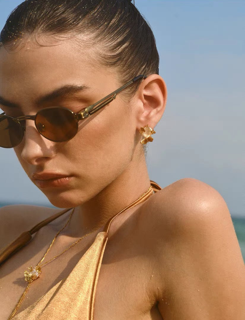 Sunlit Tide butterfly pearl chain earrings styled with matching necklace