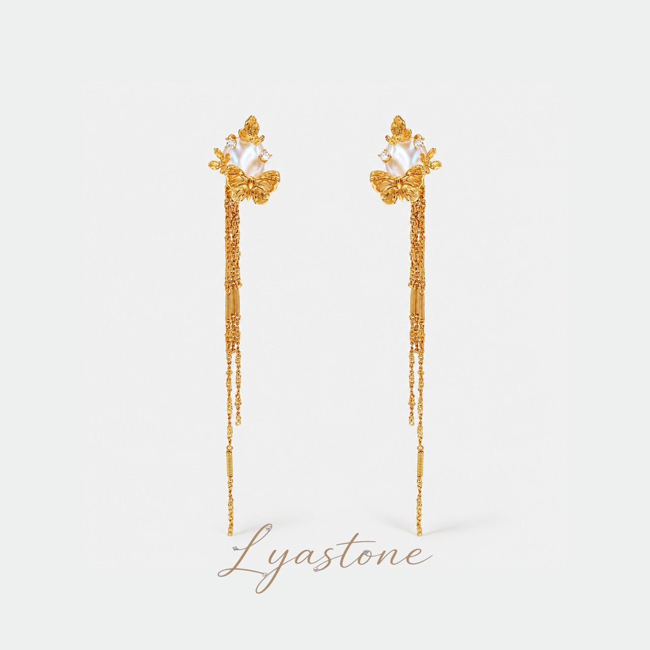 Sunlit Tide Butterfly Pearl Chain Earrings in gold by Lyastone