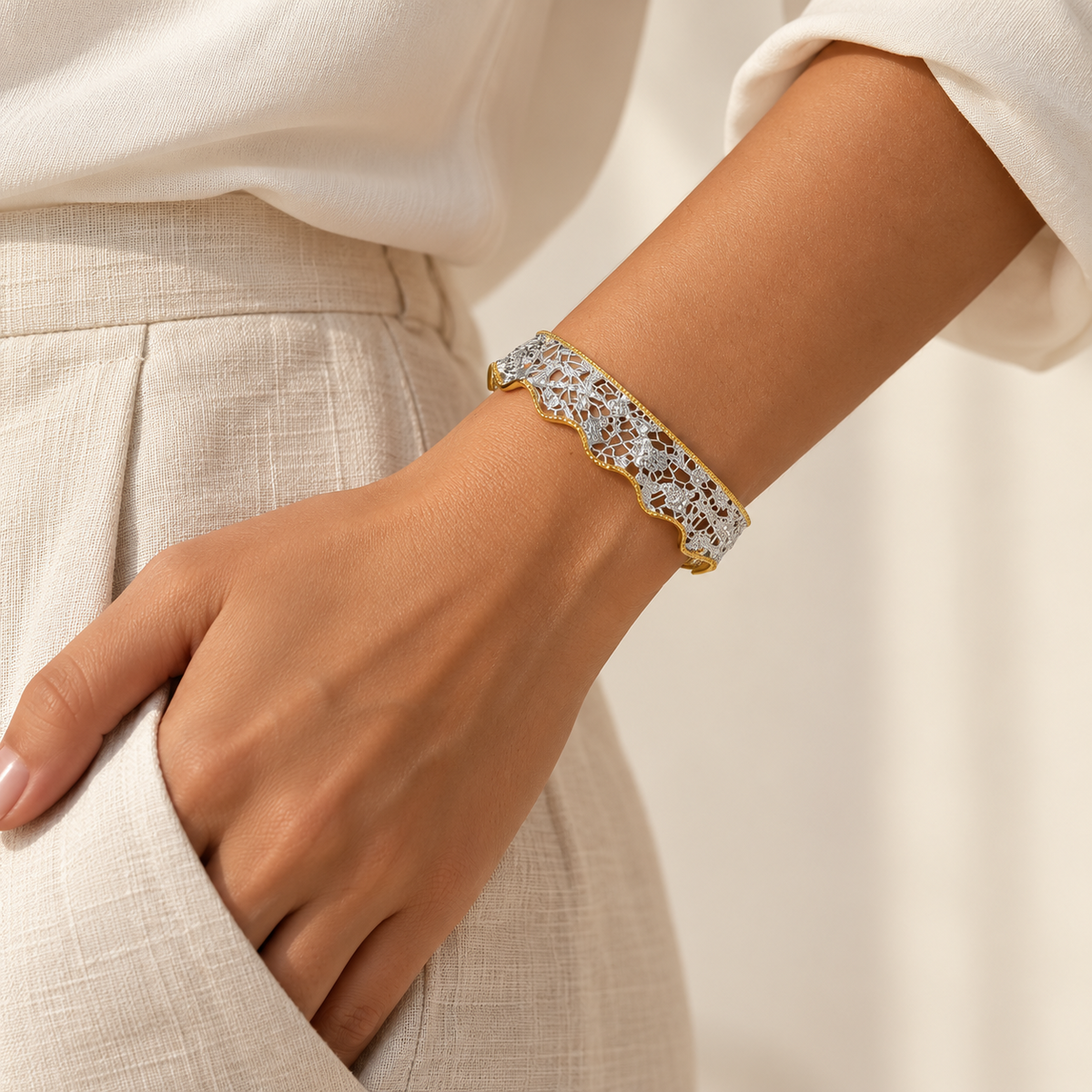 Model wearing the Venetian Lace two-tone silver and gold cuff bracelet