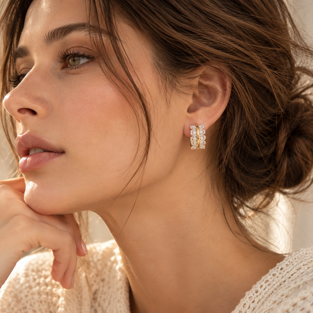 Model wearing Venetian Lace gold and silver two-tone hoop earrings