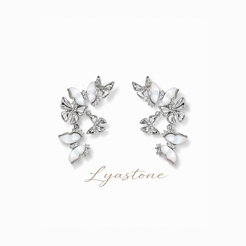 White mother of pearl butterfly drop earrings in silver tone by Lyastone