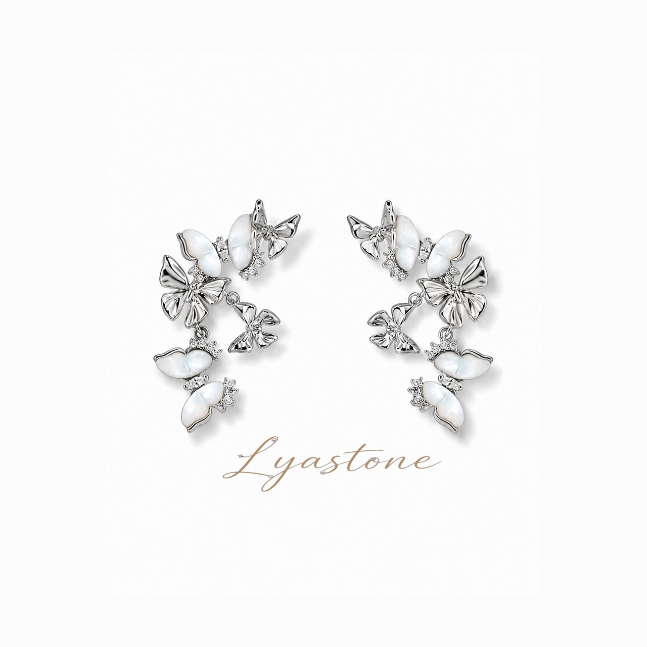 White mother of pearl butterfly drop earrings in silver tone by Lyastone