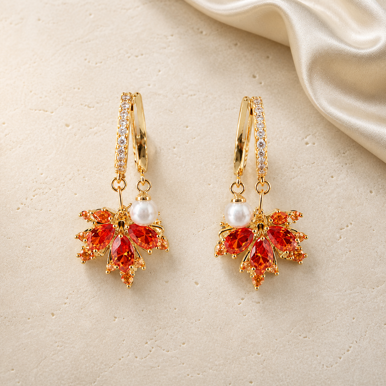 Maple Ember Earrings in gold with orange crystals and pearl accents