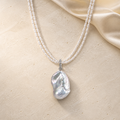 Moon Tide double strand pearl necklace with baroque pearl pendant