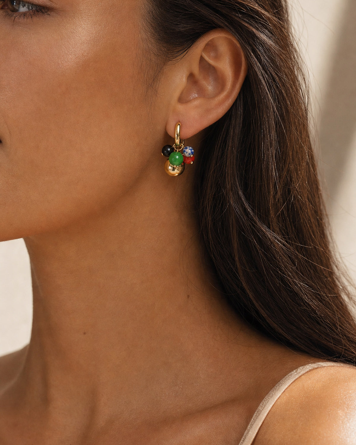 Model wearing Lyastone Mosaic Charm Huggie Earrings