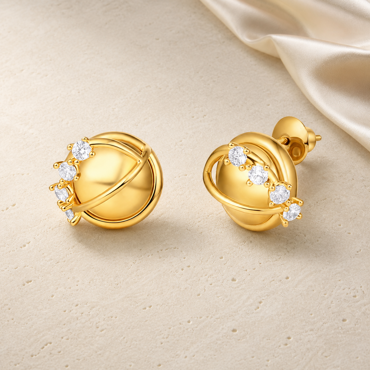 Orbit Stud Earrings on warm ivory travertine