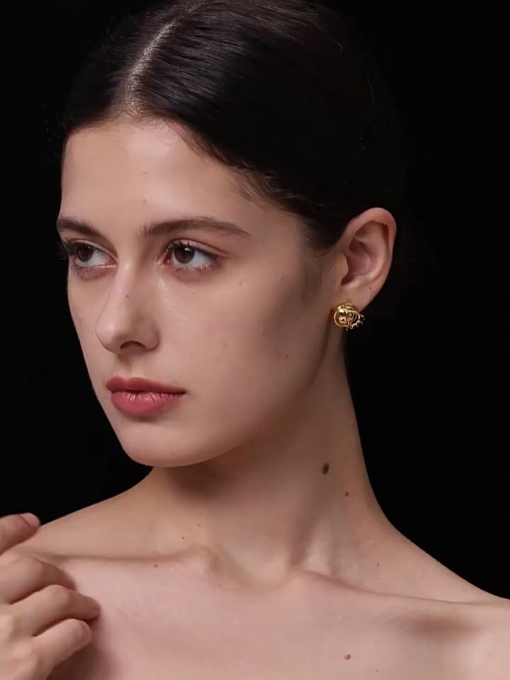 Orbit stud earrings with white zircon