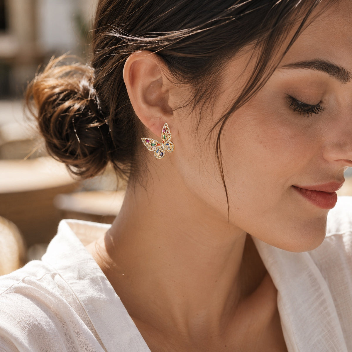 Prism Flutter Butterfly Earrings styled with a white linen shirt