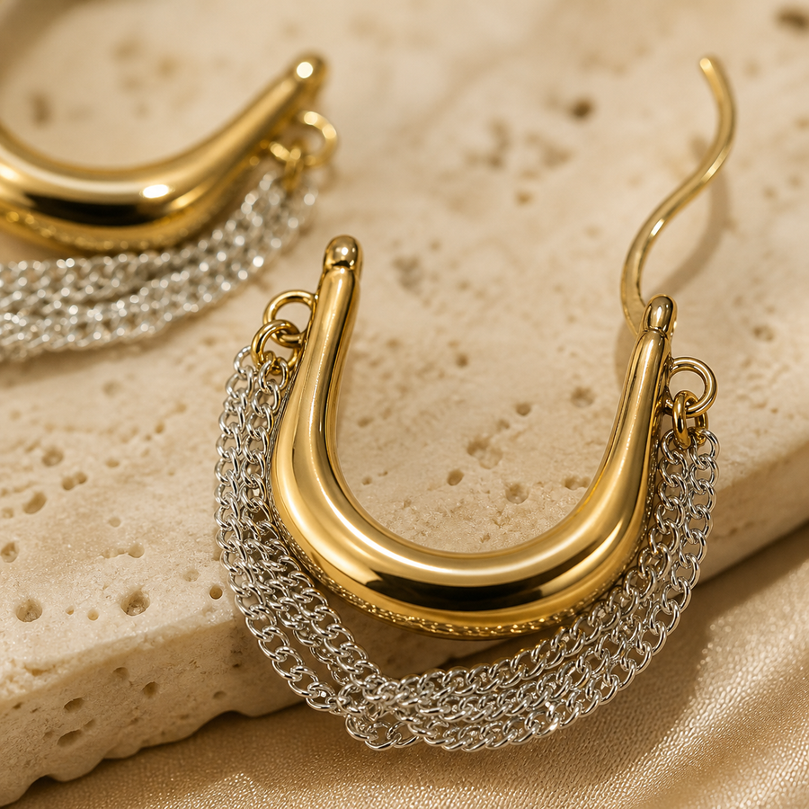 Close-up of Solara Cascade polished gold-tone hoops and fine silver-tone chains