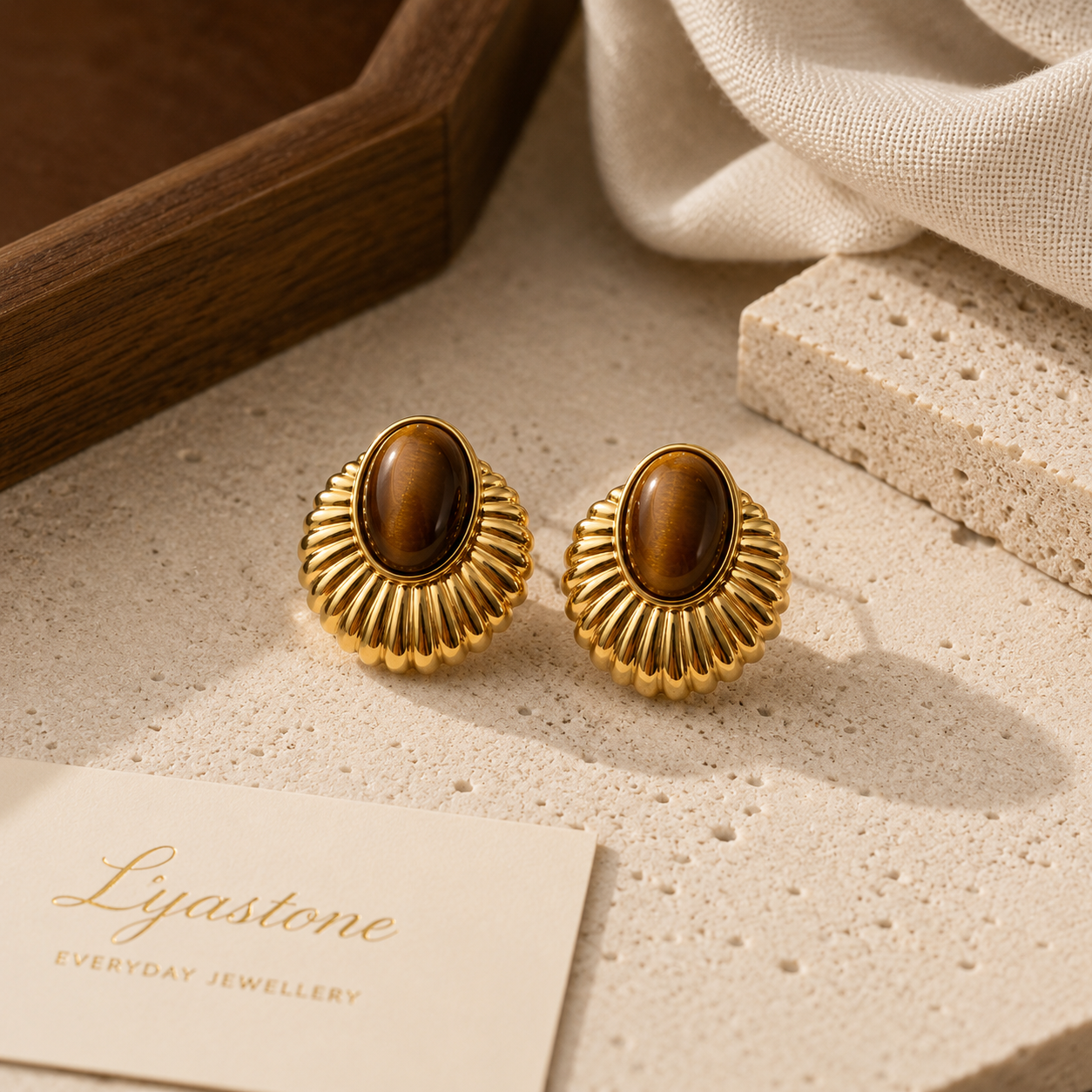 Solis tiger eye statement earrings in warm natural light