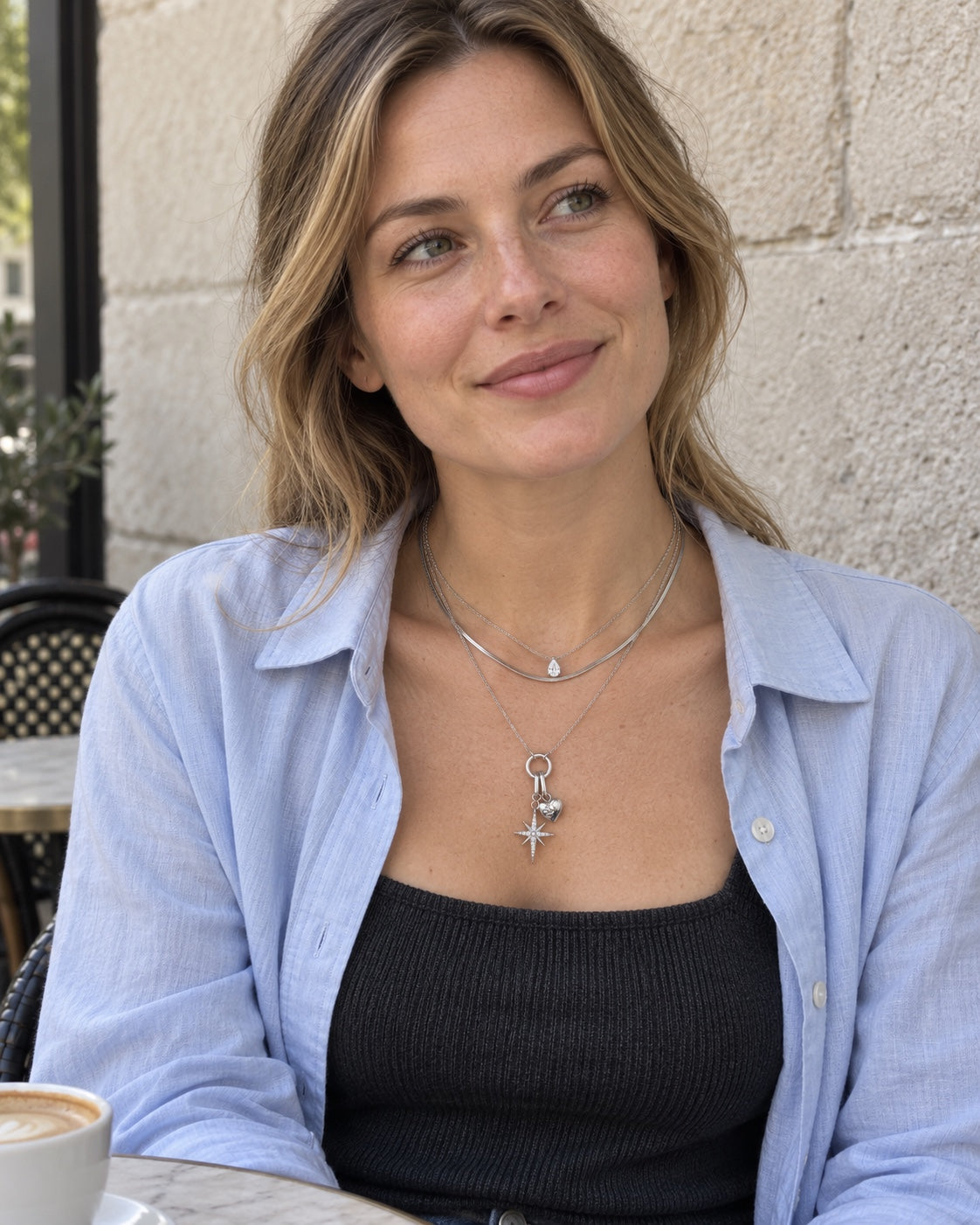 Model wearing Lyastone Polaris Heart Layered Necklace in silver